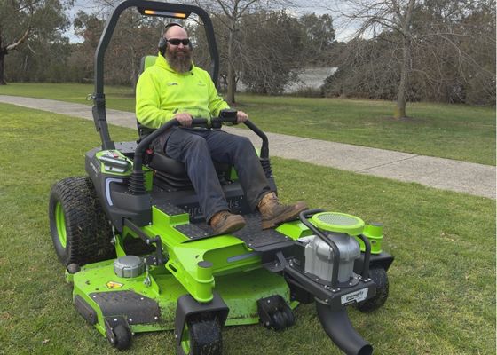 Man riding on an electric mower